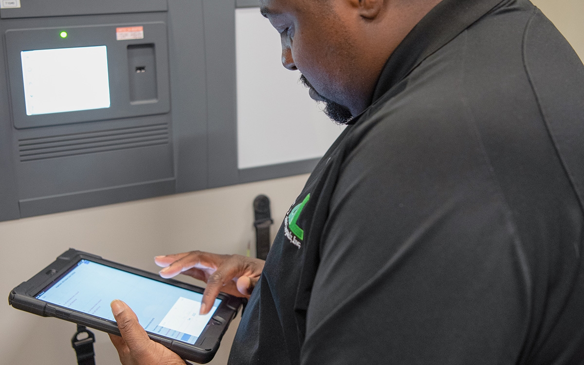 DL Repair tech with iPad