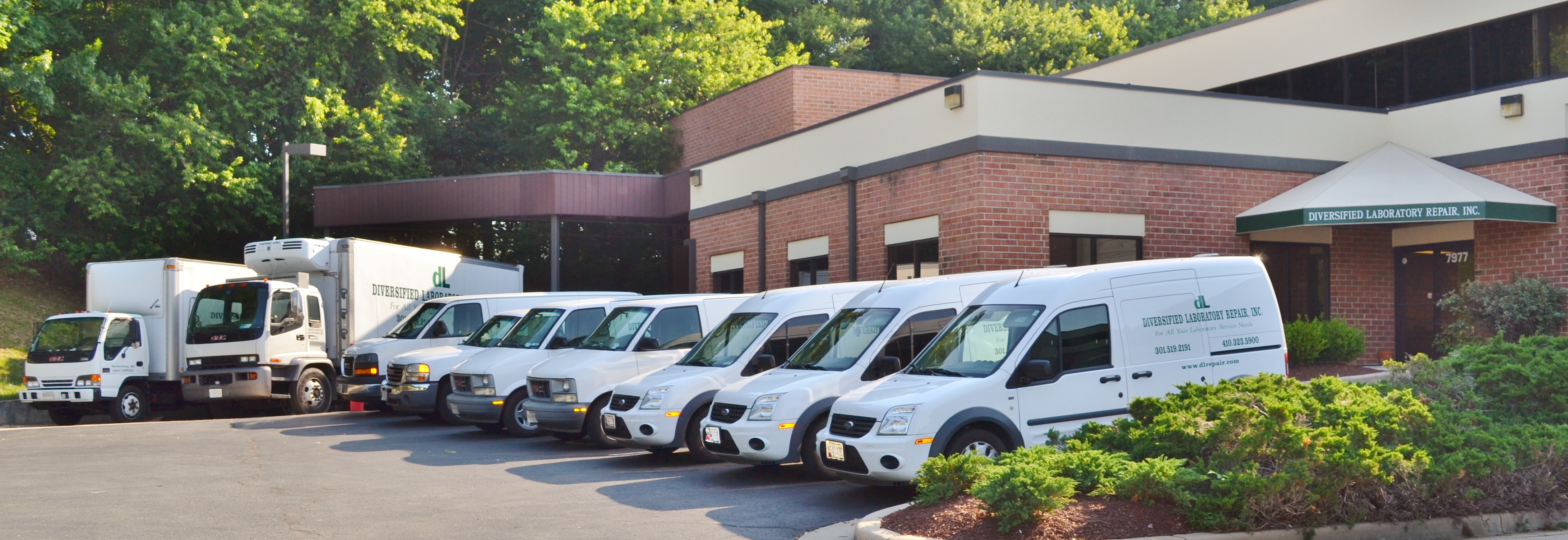 DL Repair trucks in front of building